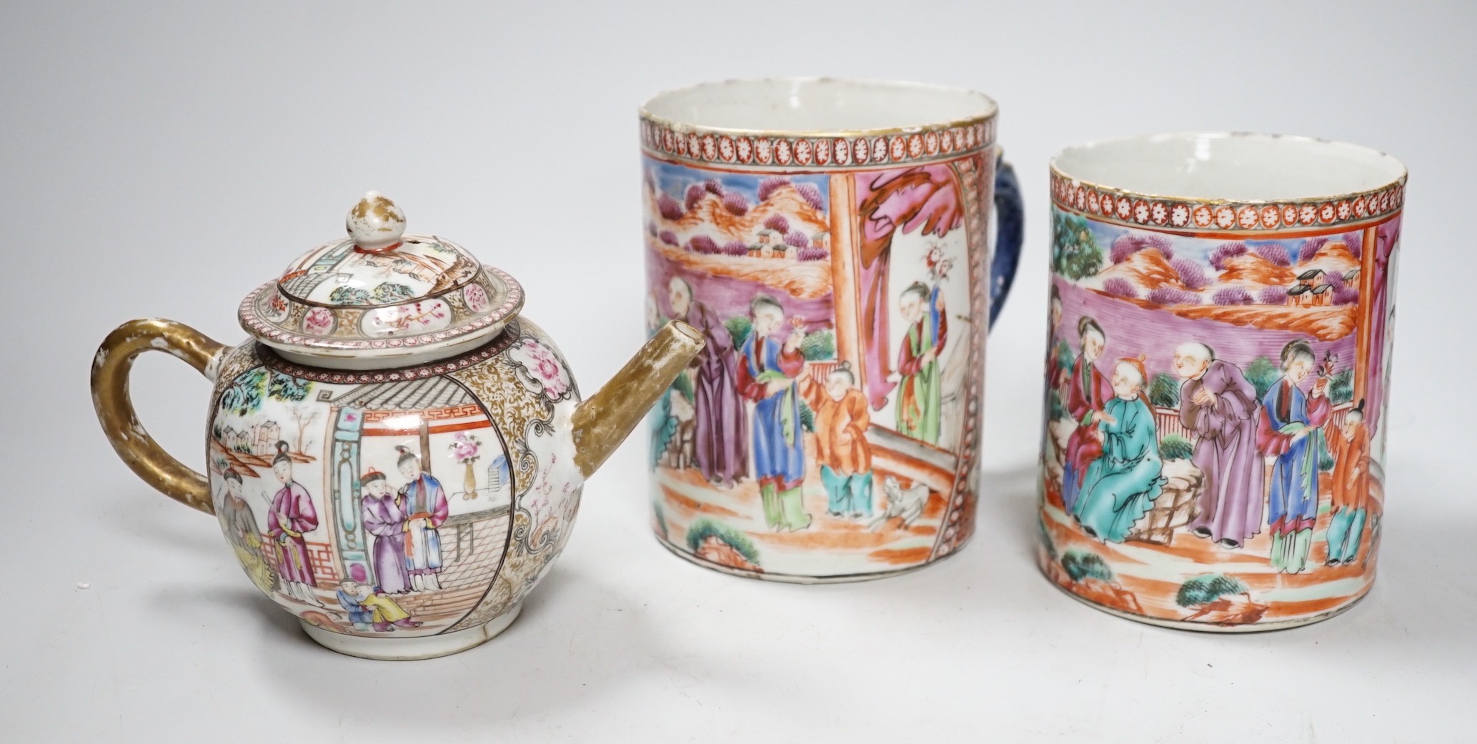 Two Chinese export 'mandarin' mugs and a similar teapot, Qianlong period, tallest mug 14cms high